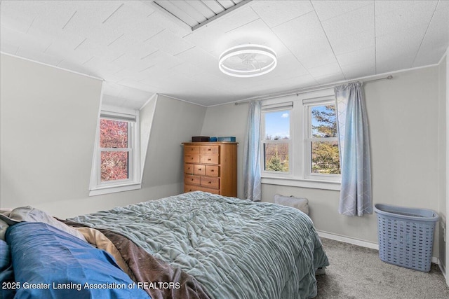 carpeted bedroom with baseboards