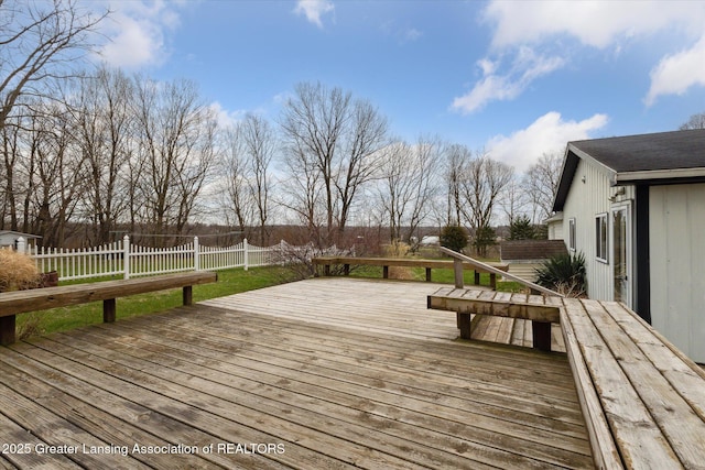 deck with a fenced backyard