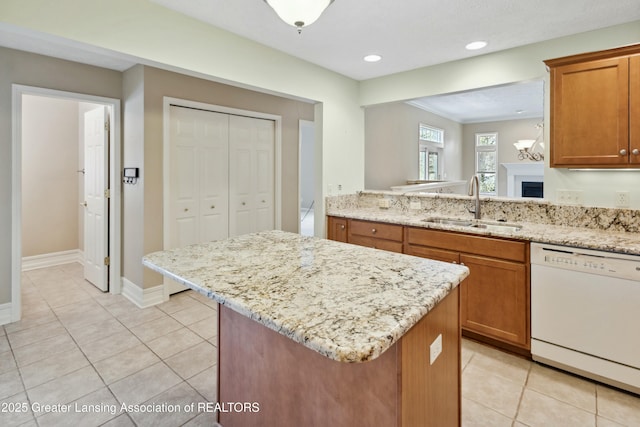 4163 Hamlet Cv, Bath, MI 48808 - kitchen with a sink, a kitchen island, light tile patterned floors, and white dishwasher