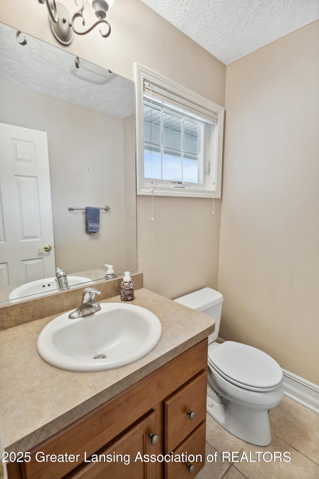 4163 Hamlet Cv, Bath, MI 48808 - bathroom with tile patterned flooring, a textured ceiling, toilet, and vanity