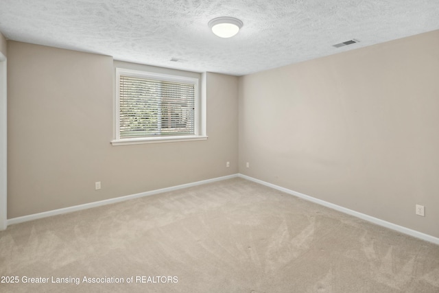 4163 Hamlet Cv, Bath, MI 48808 - carpeted spare room featuring baseboards, visible vents, and a textured ceiling