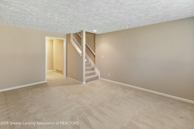 4163 Hamlet Cv, Bath, MI 48808 - below grade area with light carpet, a textured ceiling, and stairs