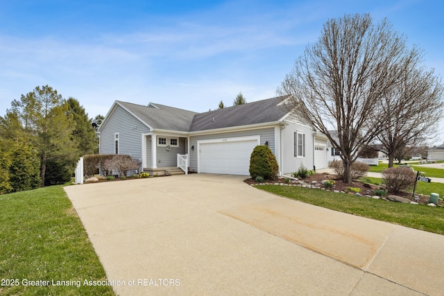 4163 Hamlet Cv, Bath, MI 48808 - view of front of property featuring concrete driveway, a garage, and a front lawn