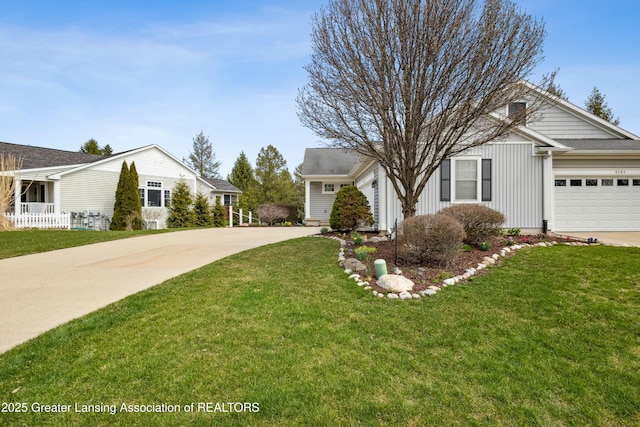 4163 Hamlet Cv, Bath, MI 48808 - ranch-style house featuring concrete driveway, a front yard, and a garage