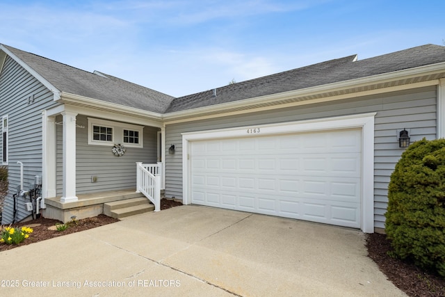 4163 Hamlet Cv, Bath, MI 48808 - view of front facade featuring driveway, a shingled roof, and a garage