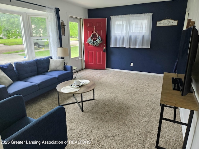 2032 Hillcrest St, Lansing, MI 48910 - carpeted living room featuring baseboards