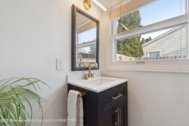 bathroom with crown molding and vanity