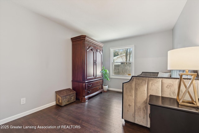 interior space with baseboards and dark wood-style flooring