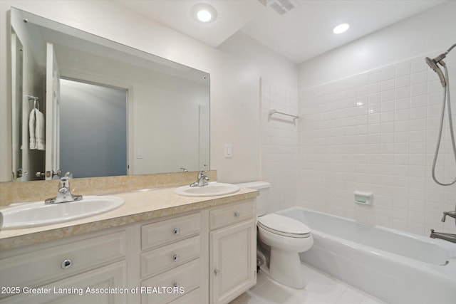 full bathroom featuring visible vents, toilet, bathing tub / shower combination, and a sink