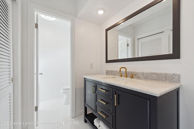 bathroom with vanity and toilet