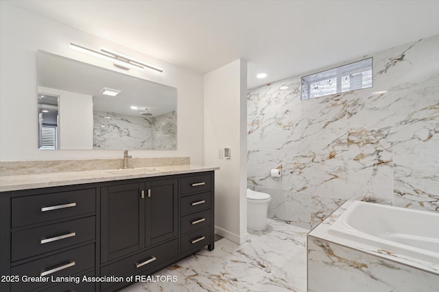 bathroom with marble finish floor, toilet, vanity, a marble finish shower, and a bath