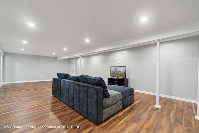 living area with baseboards, wood finished floors, and recessed lighting