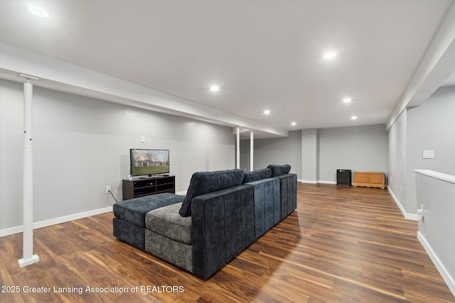 living room featuring dark wood finished floors, baseboards, and recessed lighting