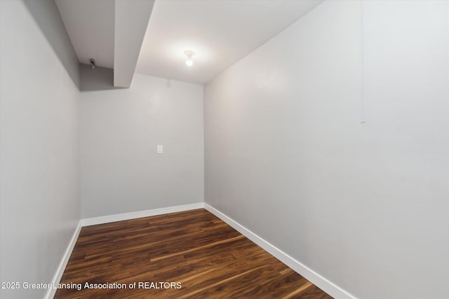 finished basement with dark wood finished floors and baseboards