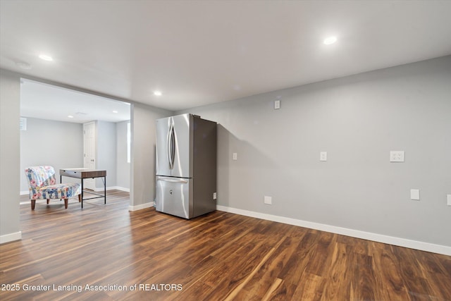 interior space featuring recessed lighting, baseboards, and dark wood-style floors