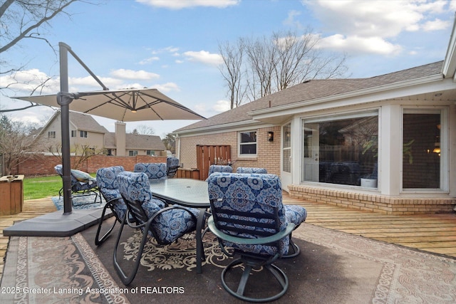view of patio featuring outdoor dining space and a deck