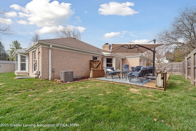 rear view of house with central AC, a fenced backyard, an outdoor hangout area, a wooden deck, and brick siding