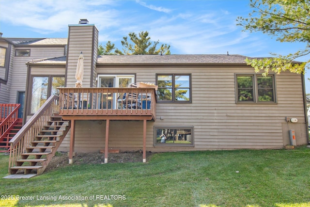 back of house with a yard, a chimney, stairway, and a deck