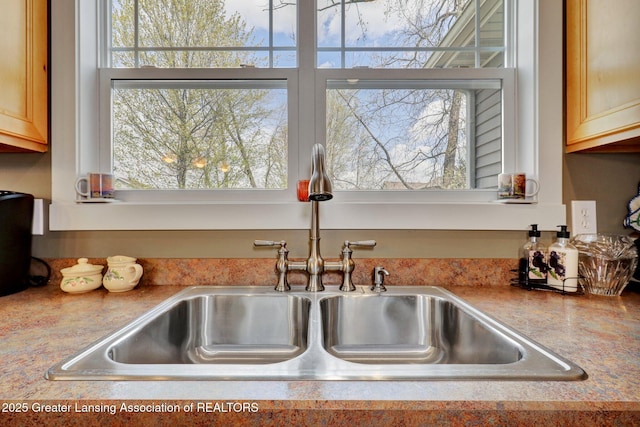room details featuring a sink and light countertops