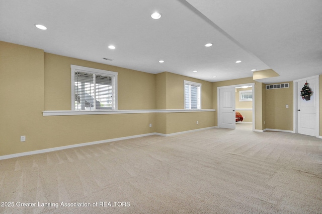 interior space with carpet floors, recessed lighting, baseboards, and visible vents