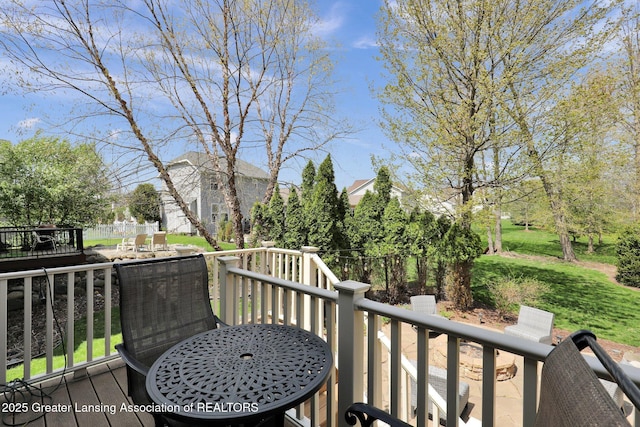 wooden deck with a yard