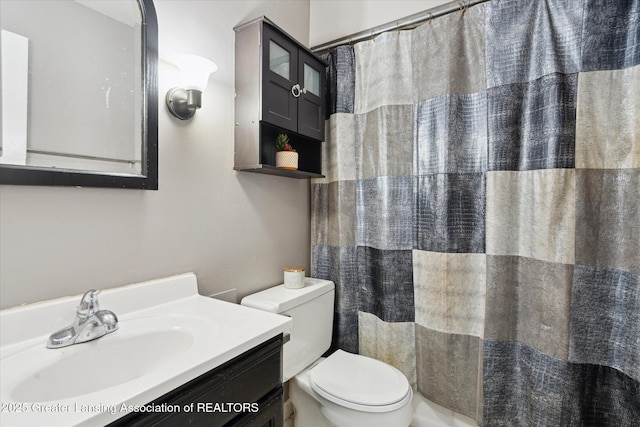 3427 W Jolly Rd, Lansing, MI 48911 - bathroom featuring vanity and a shower with shower curtain