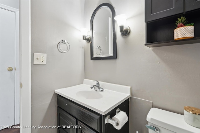 3427 W Jolly Rd, Lansing, MI 48911 - bathroom featuring vanity and toilet