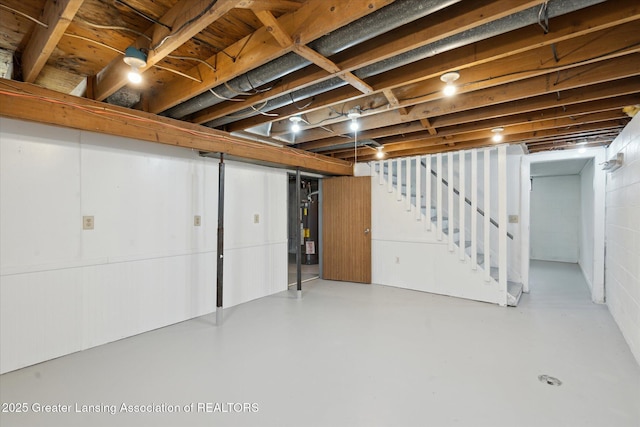 3427 W Jolly Rd, Lansing, MI 48911 - below grade area featuring stairway and water heater