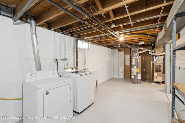 3427 W Jolly Rd, Lansing, MI 48911 - unfinished below grade area with water heater, independent washer and dryer, and heating unit