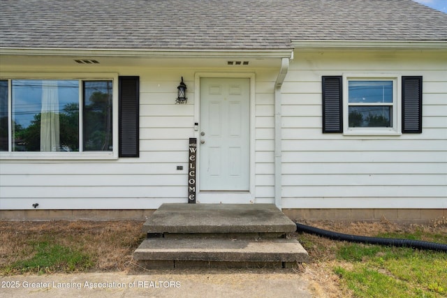 3427 W Jolly Rd, Lansing, MI 48911 - view of exterior entry with roof with shingles