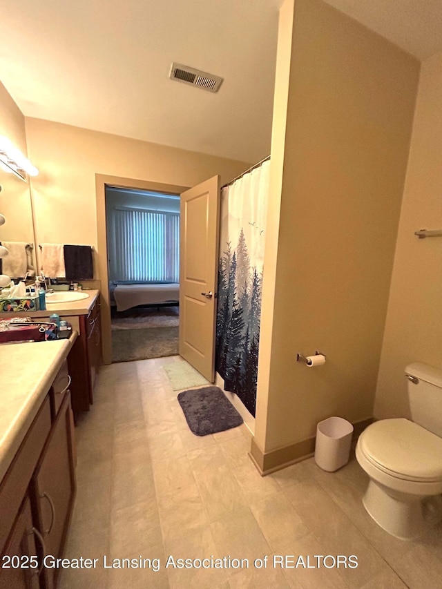 full bath featuring tile patterned floors, vanity, curtained shower, toilet, and visible vents