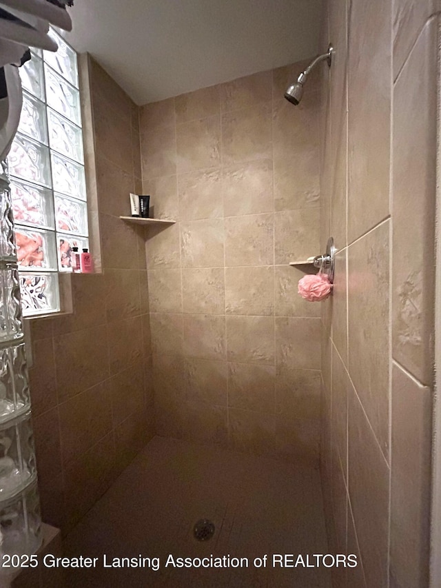 full bathroom with tiled shower