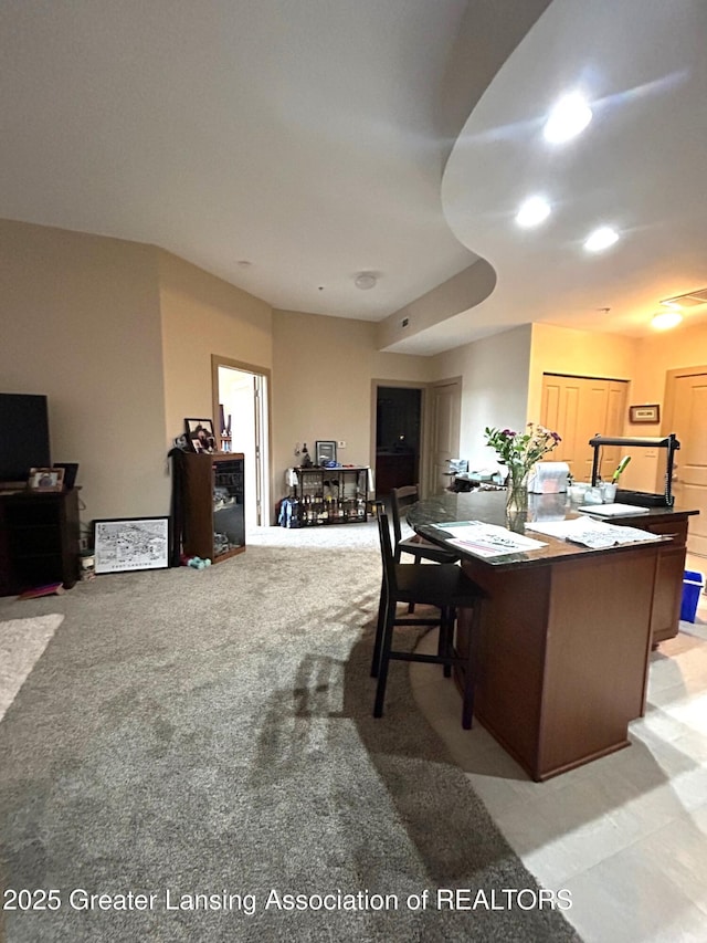 dining room with visible vents and light colored carpet
