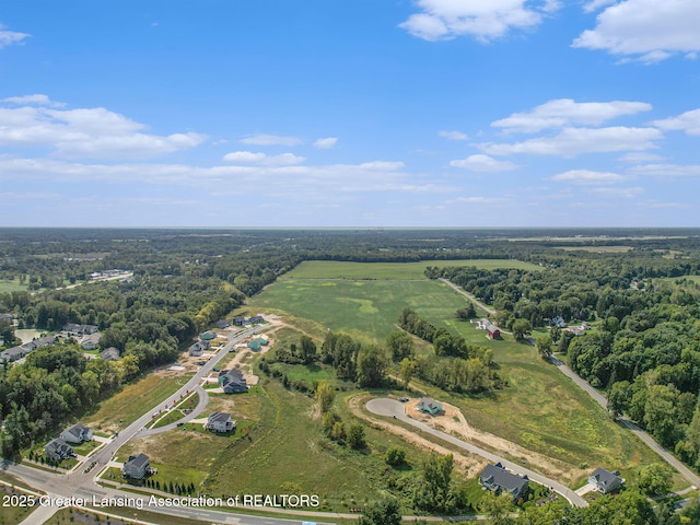 drone / aerial view with a view of trees