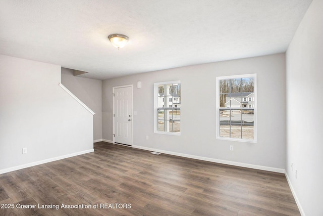 4493 Sunset Dr, Potterville, MI 48876 - interior space featuring baseboards, wood finished floors, and stairs