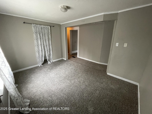 325 N Pennsylvania Ave, Lansing, MI 48912 - unfurnished bedroom featuring carpet floors, crown molding, baseboards, and a textured ceiling