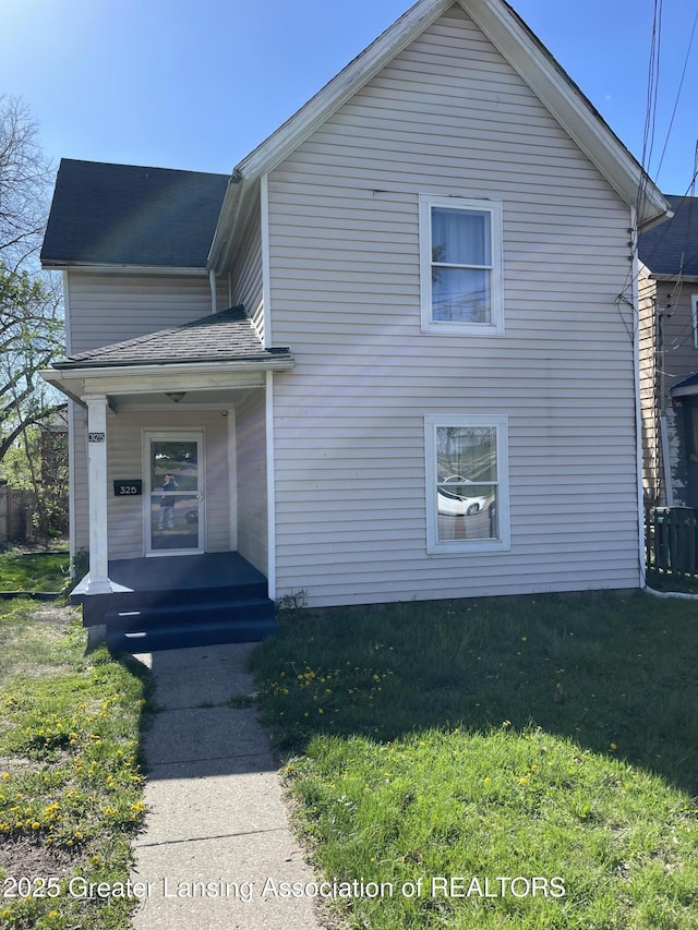 325 N Pennsylvania Ave, Lansing, MI 48912 - view of front of property featuring a front yard and covered porch