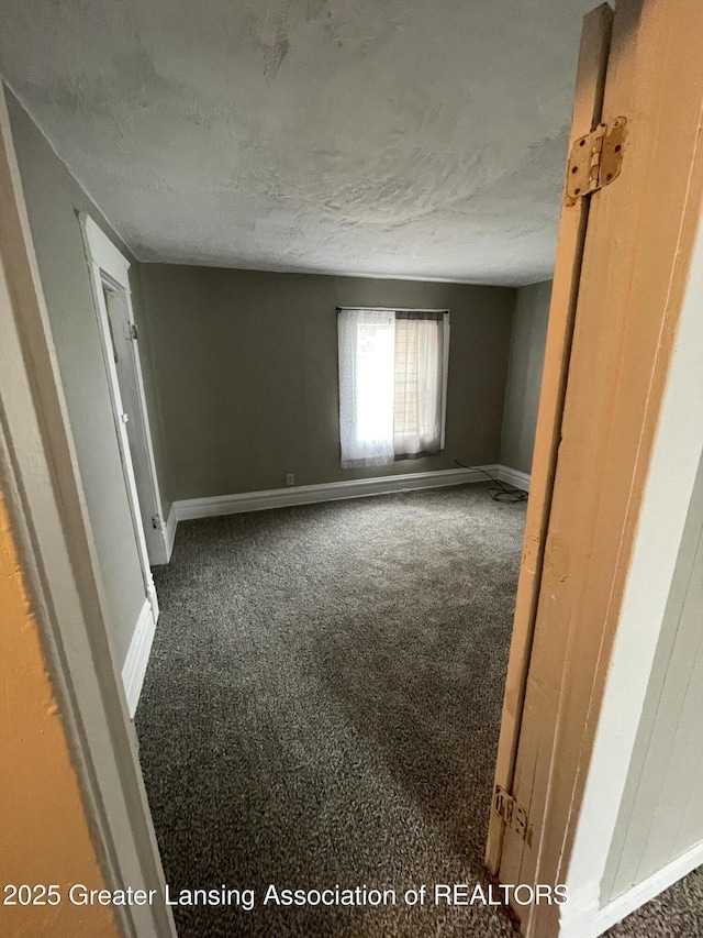 325 N Pennsylvania Ave, Lansing, MI 48912 - carpeted spare room featuring baseboards and a textured ceiling