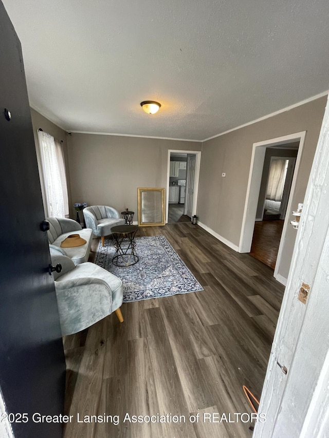 325 N Pennsylvania Ave, Lansing, MI 48912 - living room with wood finished floors, baseboards, and ornamental molding
