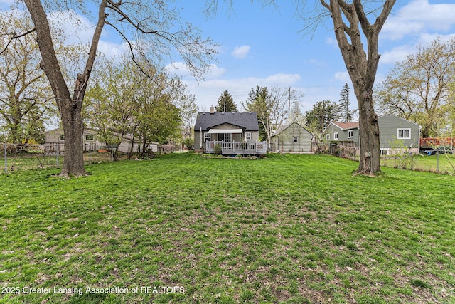 view of yard featuring a deck and a fenced backyard