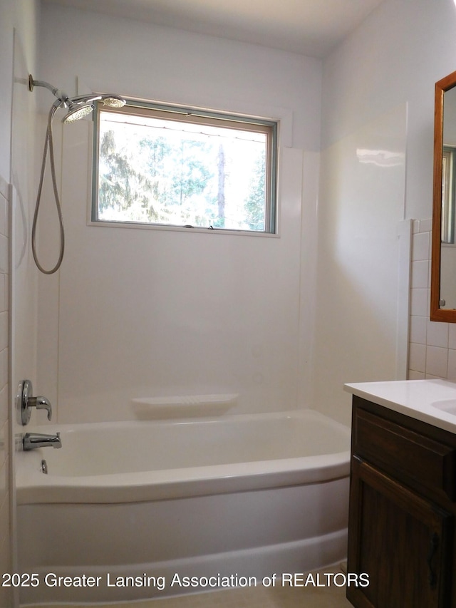 full bath featuring vanity and shower / tub combination