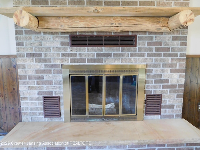 details with a fireplace and visible vents