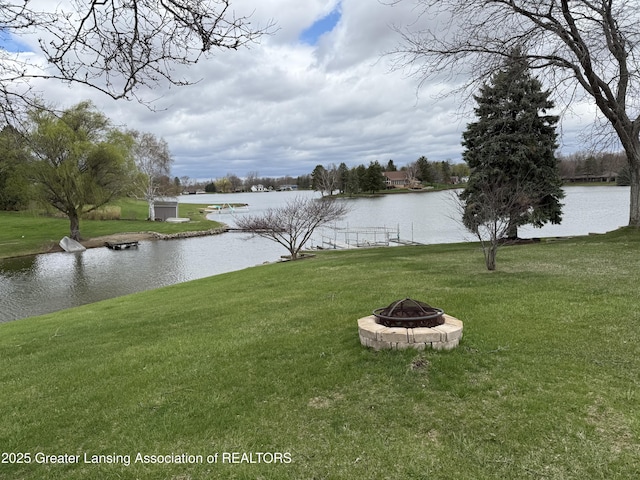 water view featuring an outdoor fire pit