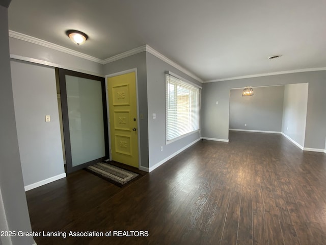 entrance foyer with baseboards, crown molding, and dark wood-type flooring