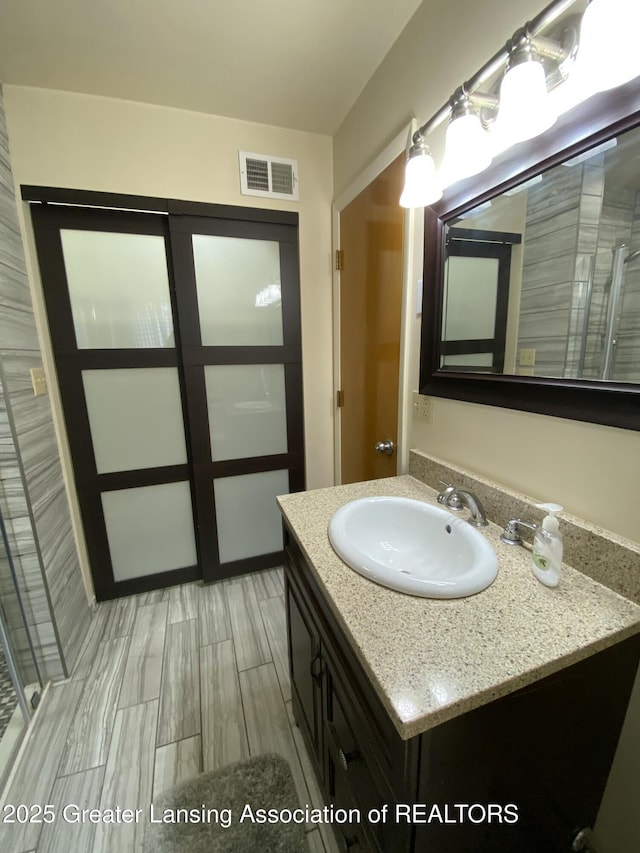 bathroom featuring visible vents and vanity