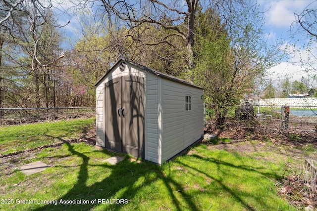view of shed with a fenced backyard