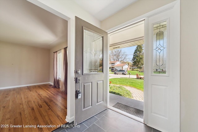 entryway featuring baseboards and plenty of natural light