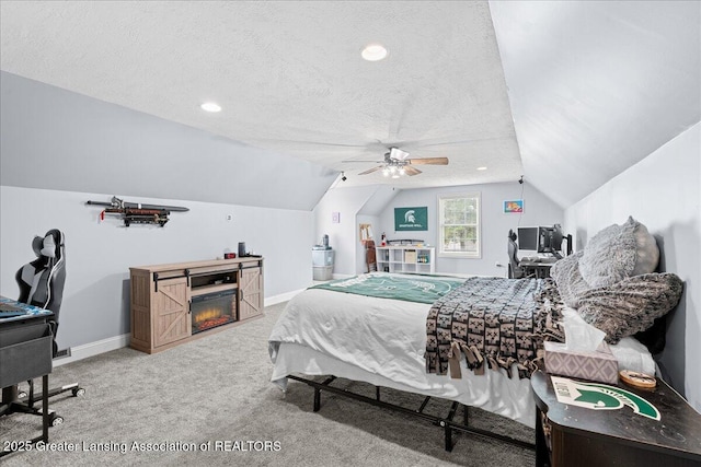 carpeted bedroom featuring lofted ceiling, a ceiling fan, baseboards, and a textured ceiling