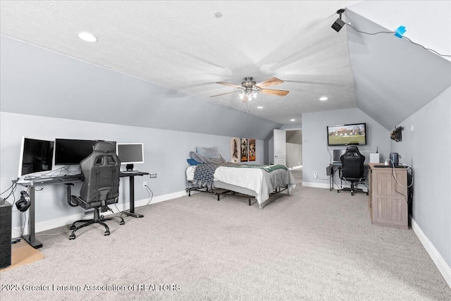 bedroom with vaulted ceiling, carpet floors, and baseboards