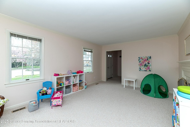game room with crown molding, baseboards, visible vents, and carpet floors